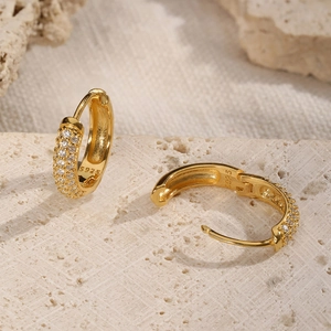 Macro shot of 18K gold-plated S925 silver hoop earrings with micro-pave cubic zirconia stones