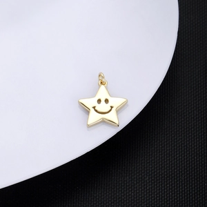 Macro shot of 18K gold-plated star pendant featuring a hollow smile face design