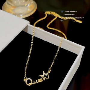Elegant gold Queen letter pendant necklace with crown detail and sparkling white zircons