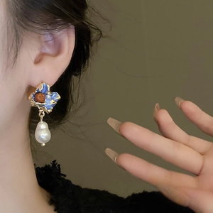 French vintage baroque pearl earrings with blue enamel oil painting style on model