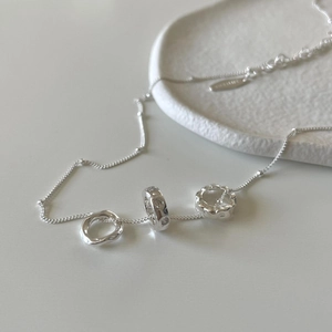 925 Sterling silver necklace with geometric irregular zircon pendants on white ceramic tray