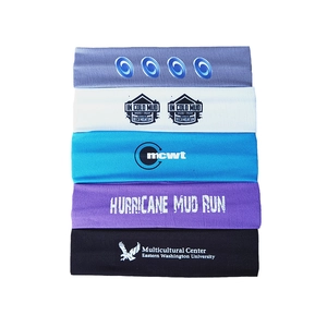 Detail showing a stack of five colorful elastic yoga headbands with custom printed logos