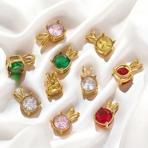 18K gold plated bunny-shaped pendants with colorful zircons on white silk background