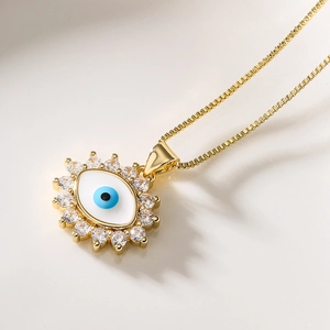 Gold plated evil eye pendant necklace with cubic zirconia sunburst charms for women