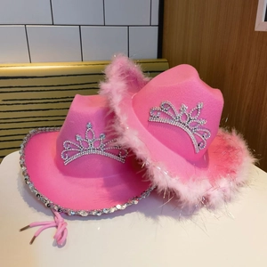 Pink western cowboy hats with rhinestone crown and feather trim for party costumes