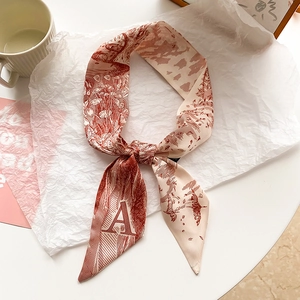 French vintage skinny scarf in beige and rust red with artistic letter A print