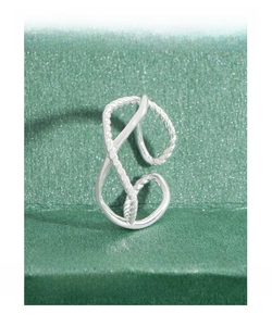 Detailed macro view of S925 sterling silver minimalist twisted rope hollow ring texture