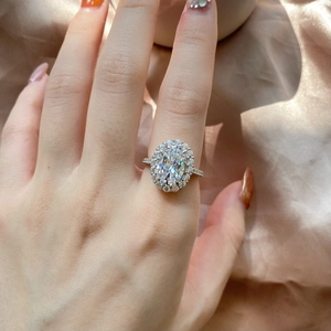 Close-up of elegant S925 silver ring with oval cut gemstone on silk background
