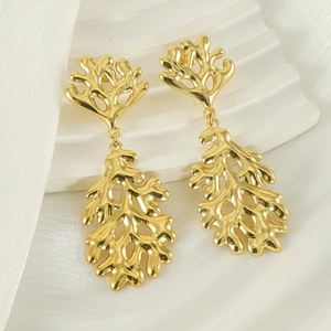 Irregular lava leaf earrings plated in 18K gold featuring vintage organic branch textures