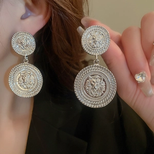 Vintage silver lion head embossed drop earrings with geometric woven rope texture