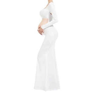 Detailed side view of white maternity photoshoot gown featuring long sleeves and fishtail hem