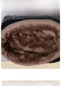 Detailed close-up of thick fleece lining and grey knit fabric for cold weather warmth