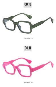Detail view of square matte green and pink retro sunglasses with metallic rivets