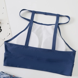 Detail view of navy blue bikini top showing inner breathable mesh lining and removable pads