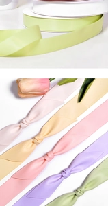 Detail of colorful silk satin ribbons in pastel tones for gift wrapping and hair decor