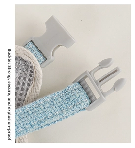 Detail of the blue woven pet harness featuring a secure buckle and breathable mesh lining