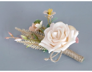 Detail of cream rose boutonniere with rustic jute twine wrap and green leaf accents