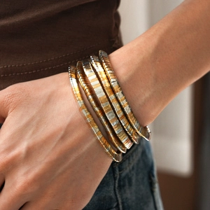 Multi-layer two-tone tubogas wrap bracelet in gold and silver metallic weave style