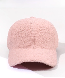 Detailed front view showing soft texture of pink teddy fleece baseball cap