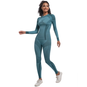 Detail view of the seamless knit geometric texture and breathable holes on the blue yoga set