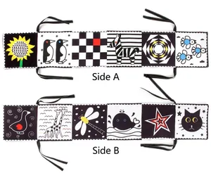Detailed double-sided view of high-contrast black and white baby cloth book with cartoon patterns