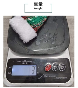 Detailed weight measurement of a green plaid mini Christmas hat with white snowflake pattern