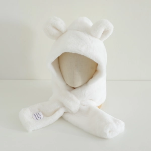 Detailed view of plush white bear ear hat with scarf showing soft faux fur texture