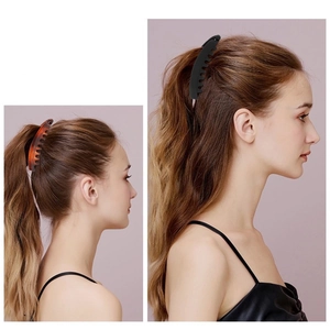 Detail showing 13cm banana hair clips in black and amber on high ponytail hairstyles
