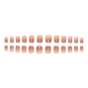 French style press-on nails with nude pink gradient and white tips in a 24-piece set