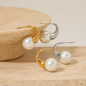 Elegant gold and silver stainless steel hook earrings with lustrous round white pearls