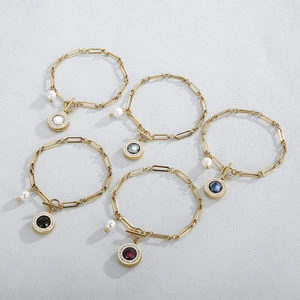Set of five gold stainless steel bracelets with pearl charms and colorful stone pendants