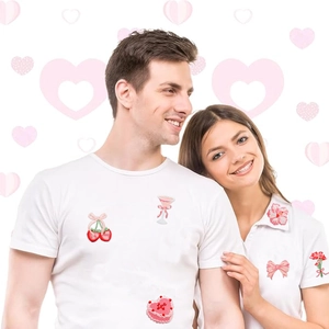 Pink romantic embroidery patches with cherry and heart cake motifs on white T-shirts