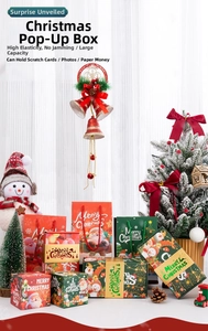 Détail du coffret cadeau de Noël rebondissant avec motifs de Père Noël et bonhomme de neige