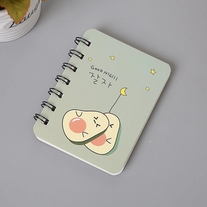 Close-up of A7 mini spiral notebook featuring a cute green avocado design on the cover
