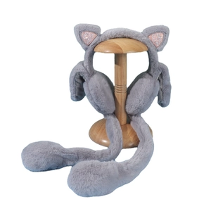 Winter plush earmuffs for kids with moving cat ears and pink sequins on white stand