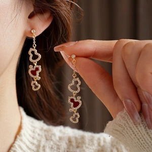 Elegant gold-plated gourd tassel earrings with red enamel and sparkling diamonds