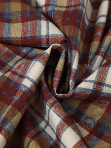 Detailed close-up of red and blue plaid fabric texture with cotton linen weaving