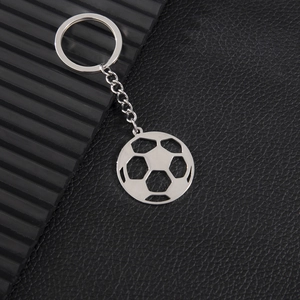 Polished silver stainless steel soccer ball keychain with cutout geometric details