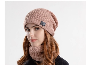 Detail showing knit texture of the winter beanie and neck warmer set in dusty pink