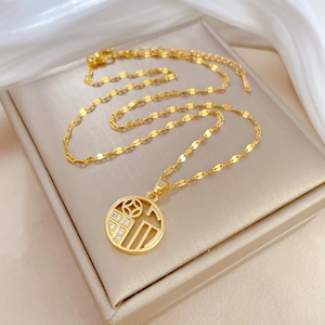 Elegant gold titanium steel necklace featuring a crystal-encrusted Fu character pendant