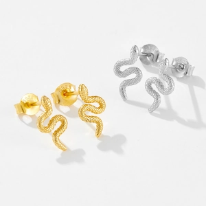 Macro view of S925 sterling silver snake stud earrings in gold and silver finishes