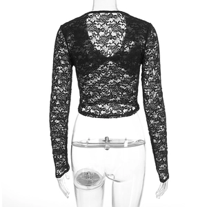 Detail view of the back design on a black floral lace crop top with sheer sleeves