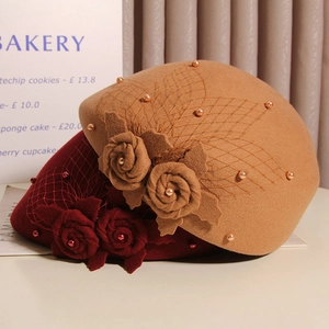 Detail of wool beret with floral felt, vintage mesh veil and pearl embellishments