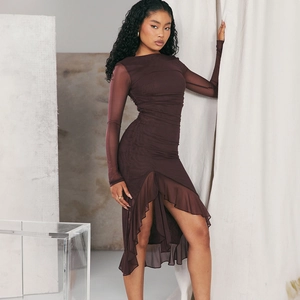 Detail of ruched mesh texture and asymmetric ruffle hem on brown long sleeve dress
