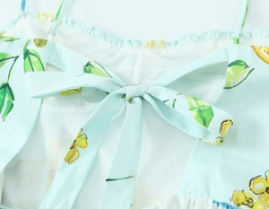 Detail of thin straps and back bow tie knot on the lemon print poplin summer dress