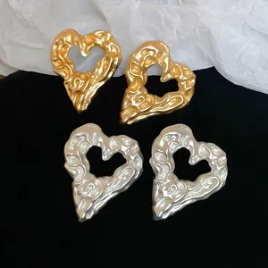 Irregular textured hollow heart earrings in gold and silver finish for women