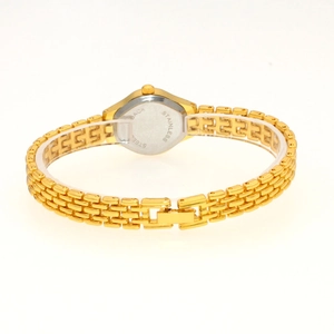 Detail shot of the gold watch back featuring a stainless steel case and clasp