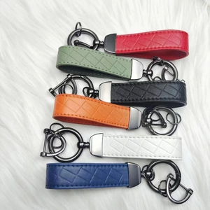 Zinc alloy leather woven car keychains in six colors on white plush background