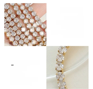 Macro detail of micro-set white zircon on 18K gold plated titanium steel bracelet