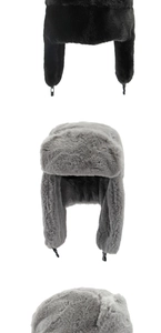 Detail view of winter faux fur trapper hats with thick thermal lining and adjustable buckles